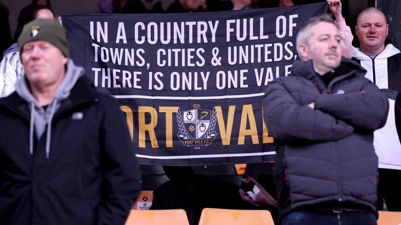 Port Vale fans with a banner that reads: 