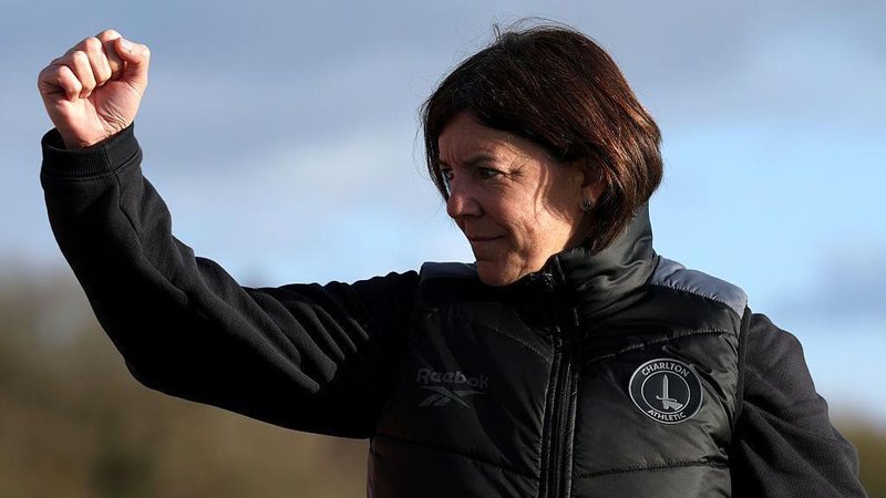 Charlton manager Karen Hills with her fist clenched in celebration