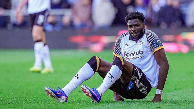 Patrick Agyemang is sat on the ground when playing for Derby against Stoke
