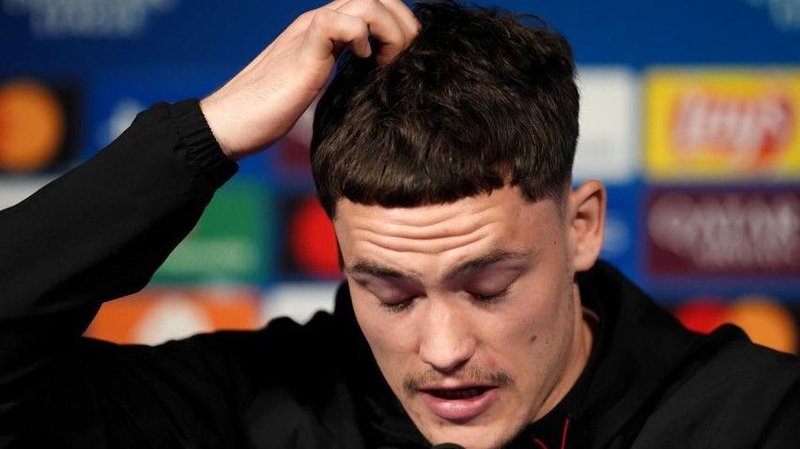 Liverpool's Florian Wirtz speaks at a new conference before his side's Champions League quarter-final against Paris St-Germain in the French capital