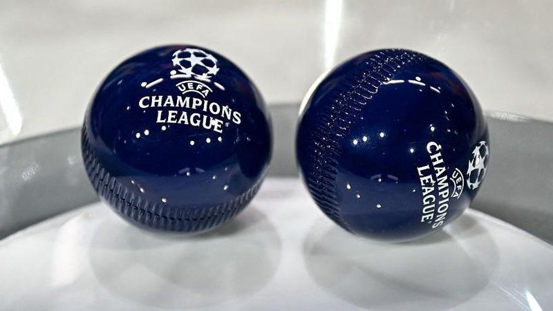 Two dark blue draw balls with the Uefa Champions League logo