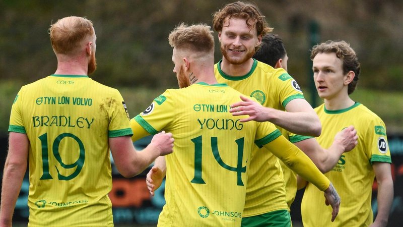Caernarfon Town players celebrate their semi-final win over Y Rhyl 1879