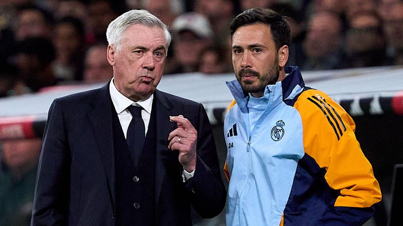 Davide Ancelotti, Assistant Manager of Real Madrid, speaks with Carlo Ancelotti, Manager of Real Madrid