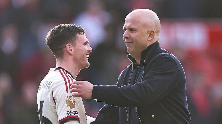 Andy Robertson (left) and Arne Slot (right)