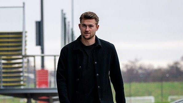 Manchester United defender Matthijs de Ligt in a black casual jacket and dark clothing beneath at Manchester United's training ground