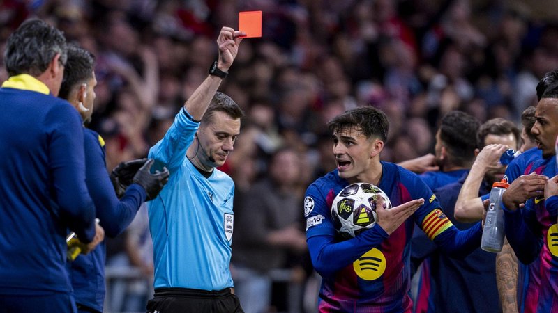 Referee Clement Turpin sends off Eric Garcia during Barcelona's Champions League second leg against Atletico Madrid in 2026 while his team-mate Pedri protests