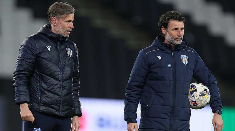 Nicky and Danny Cowley lead a pre-match training session before kick-off in a Colchester United League Two fixture