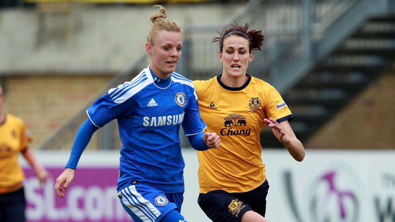 Sophie Ingle in the blue of Chelsea running with Everton's Jill Scott in 2012