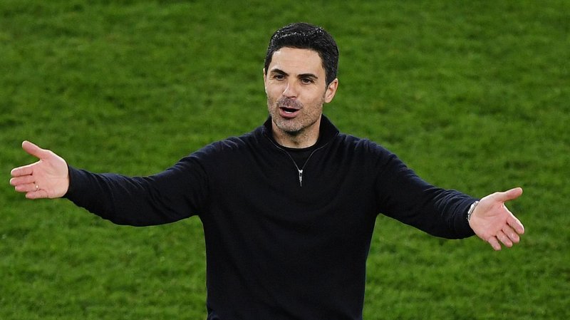 Mikel Arteta with his arms outstretched