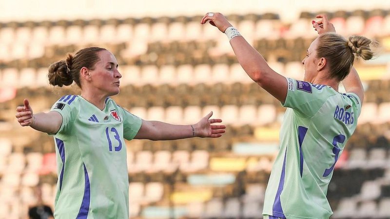 Rachel Rowe and Rhiannon Roberts both celebrate with arms spread wide