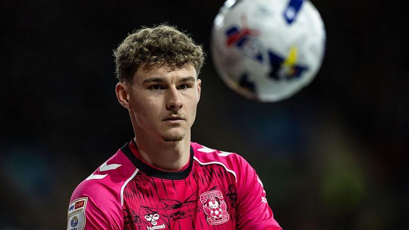 Coventry goalkeeper Carl Rushworth in the club's pink jersey