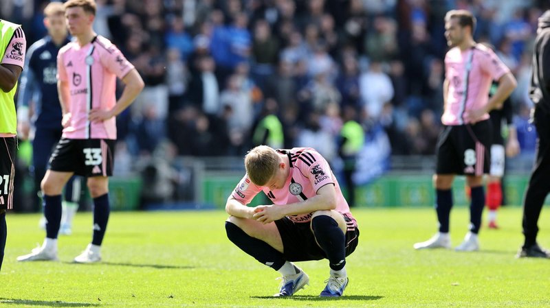 Leicester player Jordan James is hunched down in disappointment after the Foxes are beaten at Portsmouth.