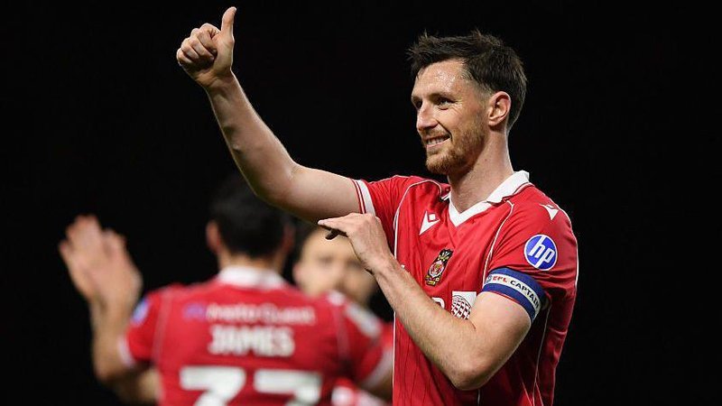 Wrexham captain Dom Hyam gives a thumbs up after the win over Oxford United