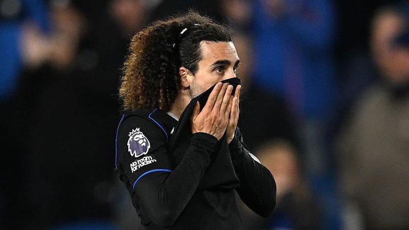 Marc Cucurella pulls his shirt up over his mouth after defeat at Brighton