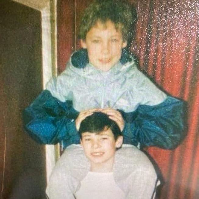 A picture Darren Acton carrying Russell Dodd on his shoulders when they were children