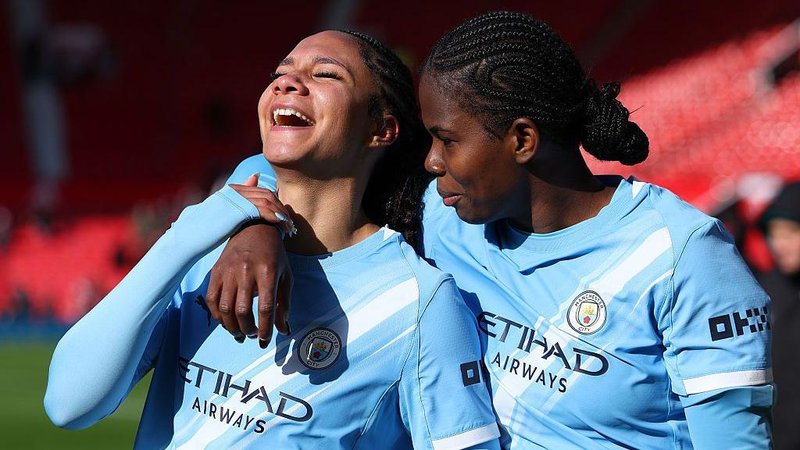 Jade Rose and Khadija Shaw celebrating after their victory over Manchester United