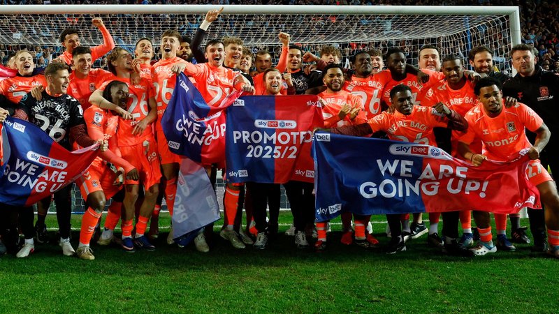 Coventry City players celebrate promotion