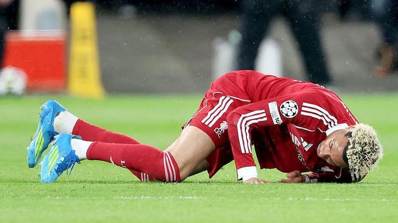 Hugo Ekitike of Liverpool is injured during the Uefa Champions League match between Liverpool and Paris St-Germain