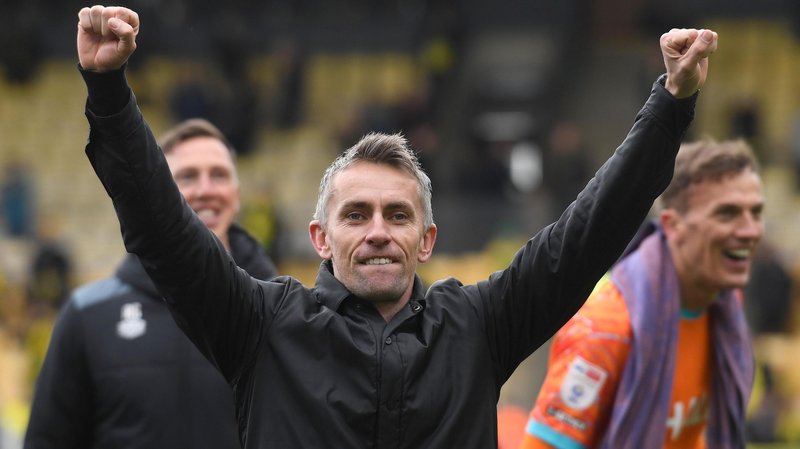 Kieran McKenna holds his arms aloft after Ipswich's victory at Norwich 