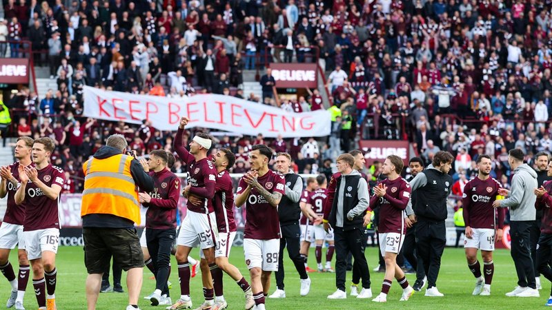 Hearts fans and players celebrate at full-time