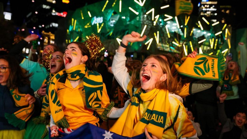 Australian fans celebrate at Melbourne's Federation Square after watching the Matildas win a match at the 2023 Fifa World Cup