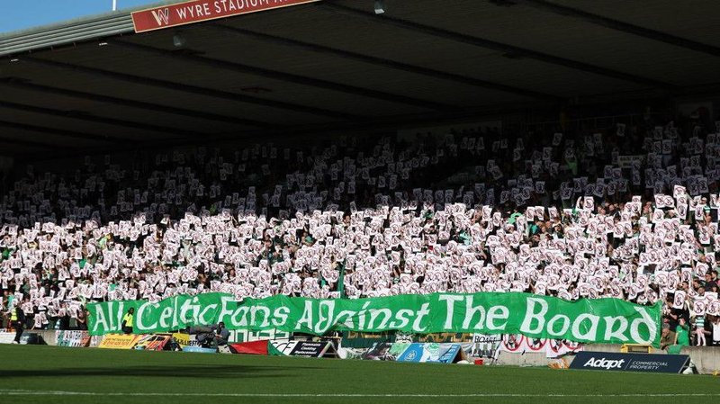 Celtic fans protest against the board during a Premier Sports Cup quarter-final match at Partick Thistle