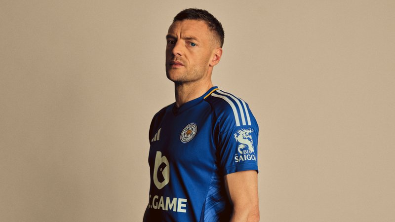 Vardy looking down the barrel of a camera lens in a photoshoot while dressing in a Leicester shirt