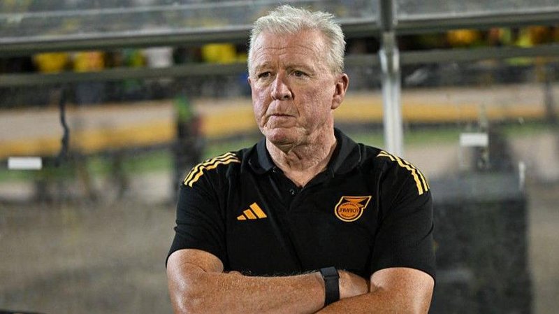Steve McClaren stands with his arms folded