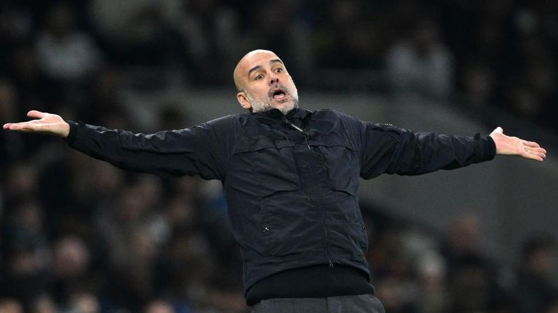 Pep Guardiola with his arms held out in a questioning gesture