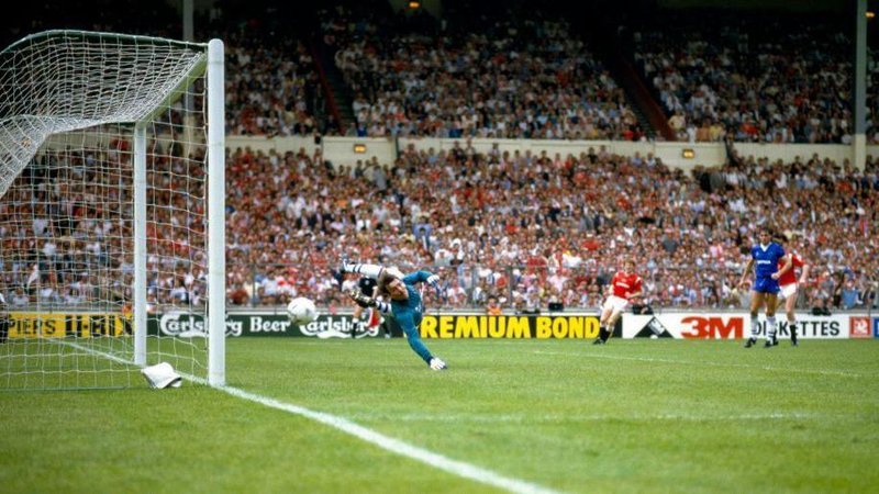 Norman Whiteside scores