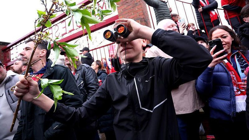 A fan is seen using binoculars outside the stadium prior to the Championship play-off semi-final match between Middlesbrough and Southampton at Riverside Stadium