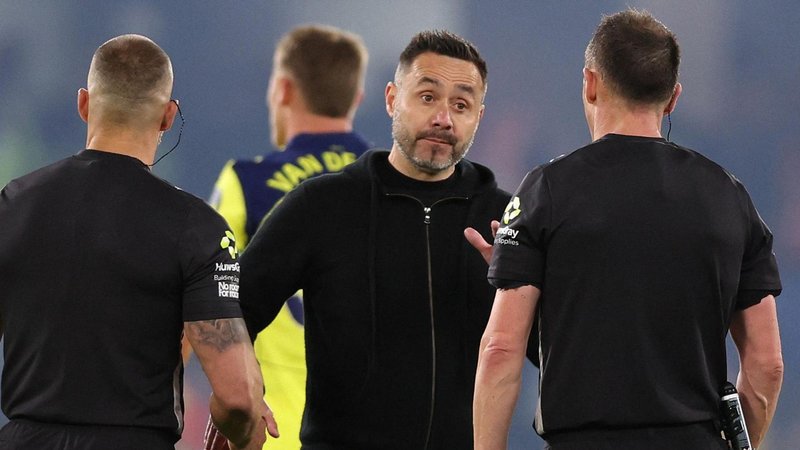 Spurs head coach in discussion with referee Stuart Attwell at the end of their Premier League loss to Chelsea at Stamford Bridge.