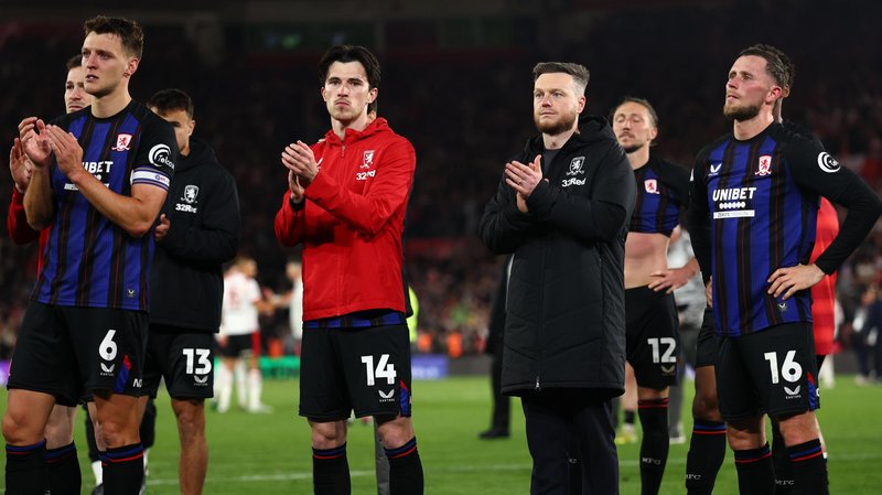 Kim Hellberg manager of Middlesbrough applauds fans at full time alongside Middlesbrough players