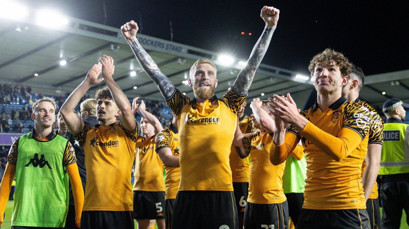 Mohamed Belloumi of Hull City, Oliver McBurnie of Hull City and Lewis Koumas of Hull City celebrate victory