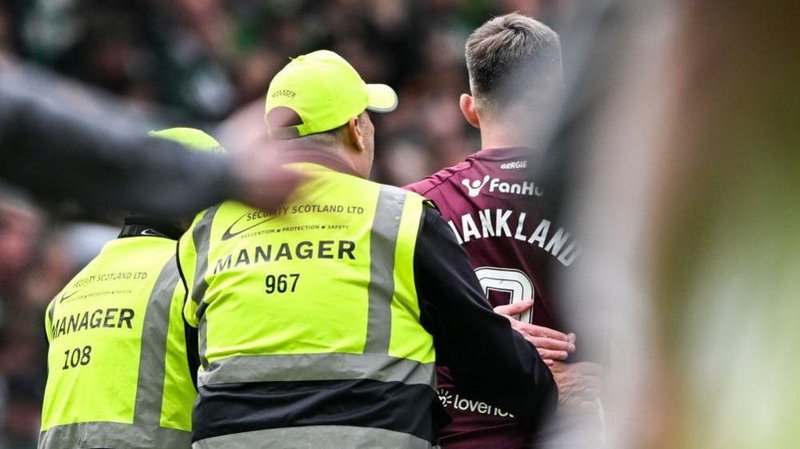  Hearts' Lawrence Shankland with stewards at full time during a William Hill Premiership match between Celtic and Heart of Midlothian at Celtic Park, on May 16, 2026, in Glasgow, Scotland.