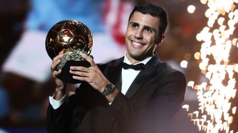 Manchester City's Spanish midfielder Rodri receives the Ballon d'Or award during the 2024 Ballon d'Or France Football award ceremony at the Theatre du Chatelet in Paris on October 28, 2024.